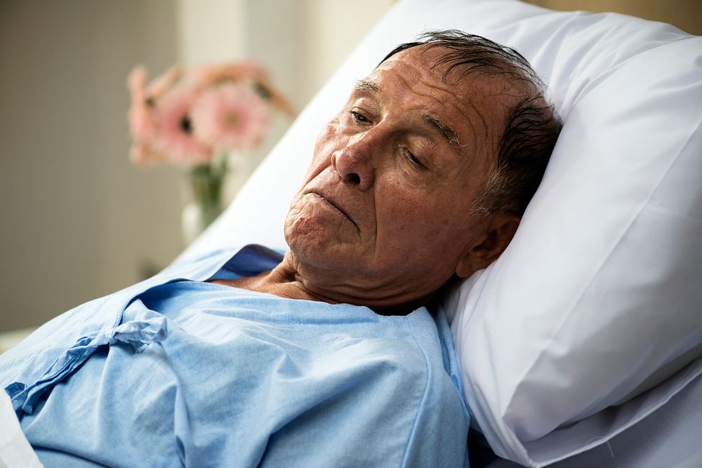 A sick elderly is staying at the hospital