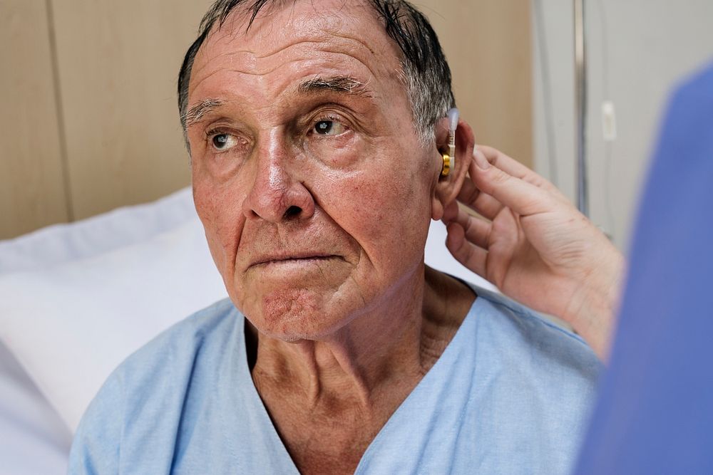 Old man wearing hearing aids