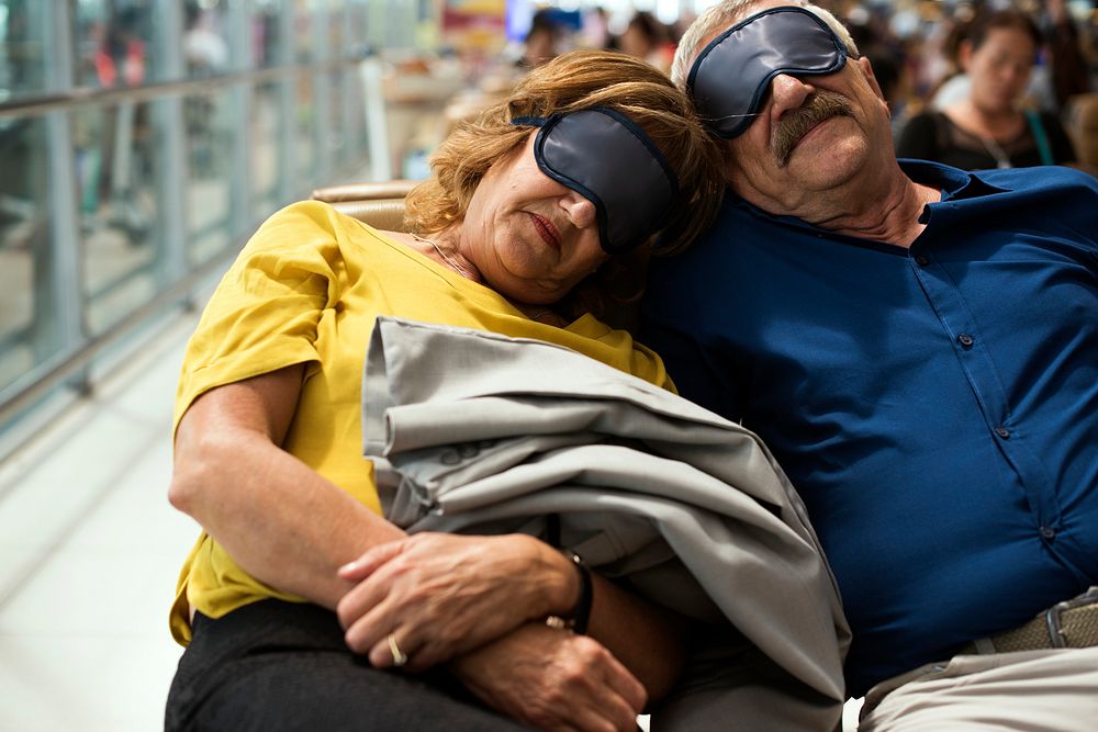 Caucasian couple is napping at the airport