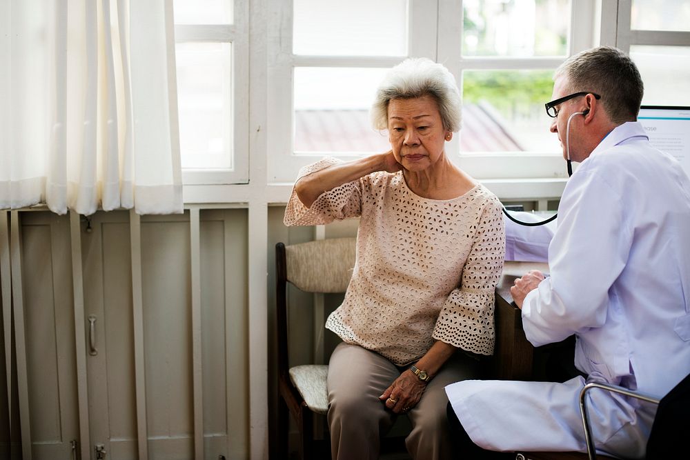 An elderly patient meeting doctor at the hospital