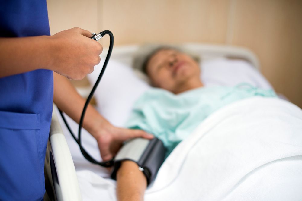 Old woman at lying in a hospital bed