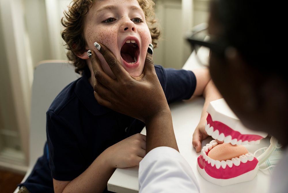 Young boy is meeting a dentist