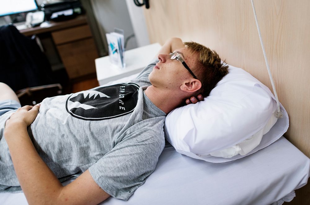 Young man in a hospital bed