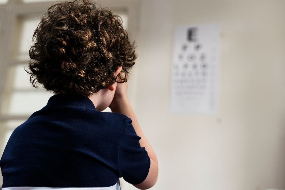Young boy having his eyes checked