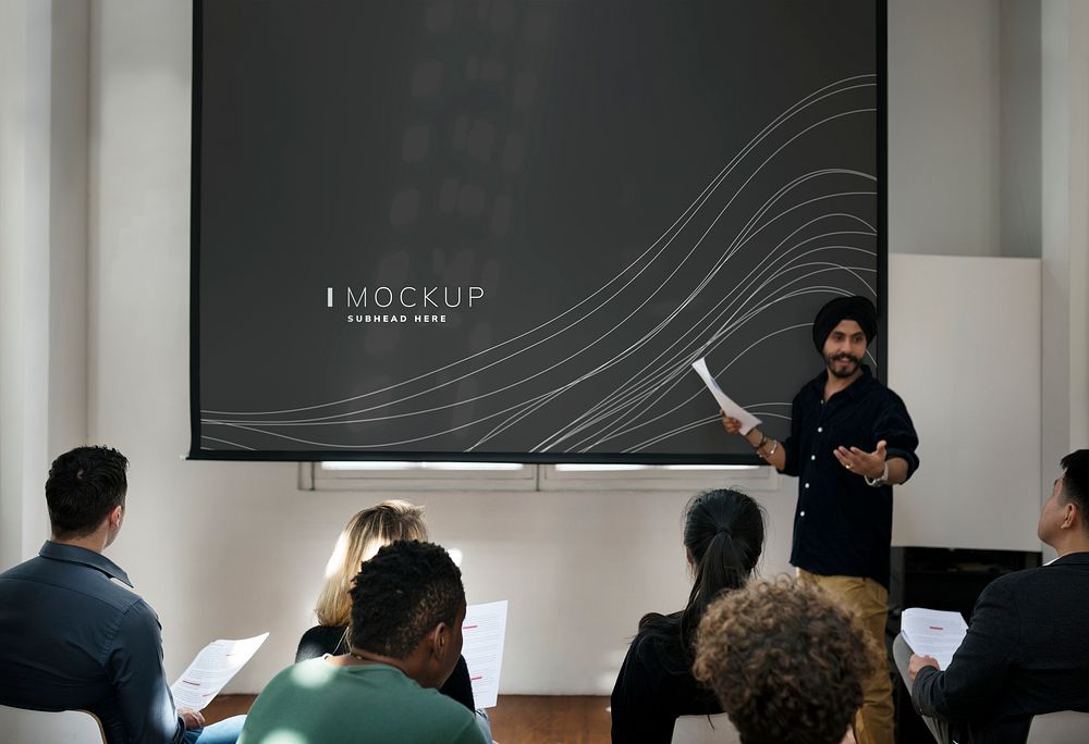 Student doing a presentation using a projector screen mockup