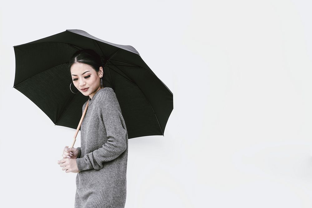 Woman holding umbrella, border background with design space