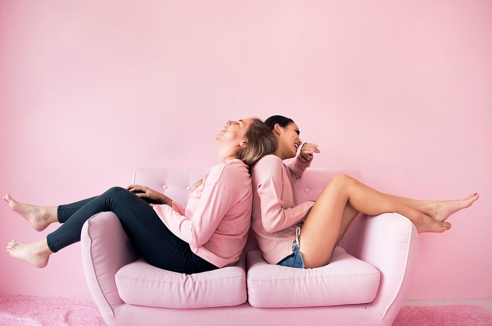 Women friends sitting in living room together