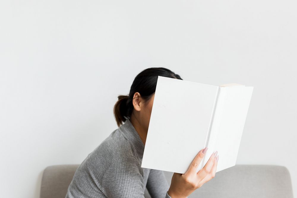 An Asian Woman Reading a Book 