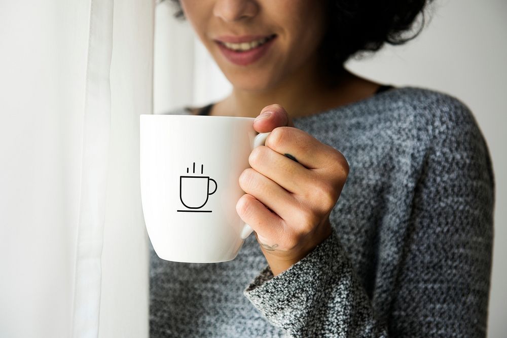 Coffee cup mockup holding by a woman