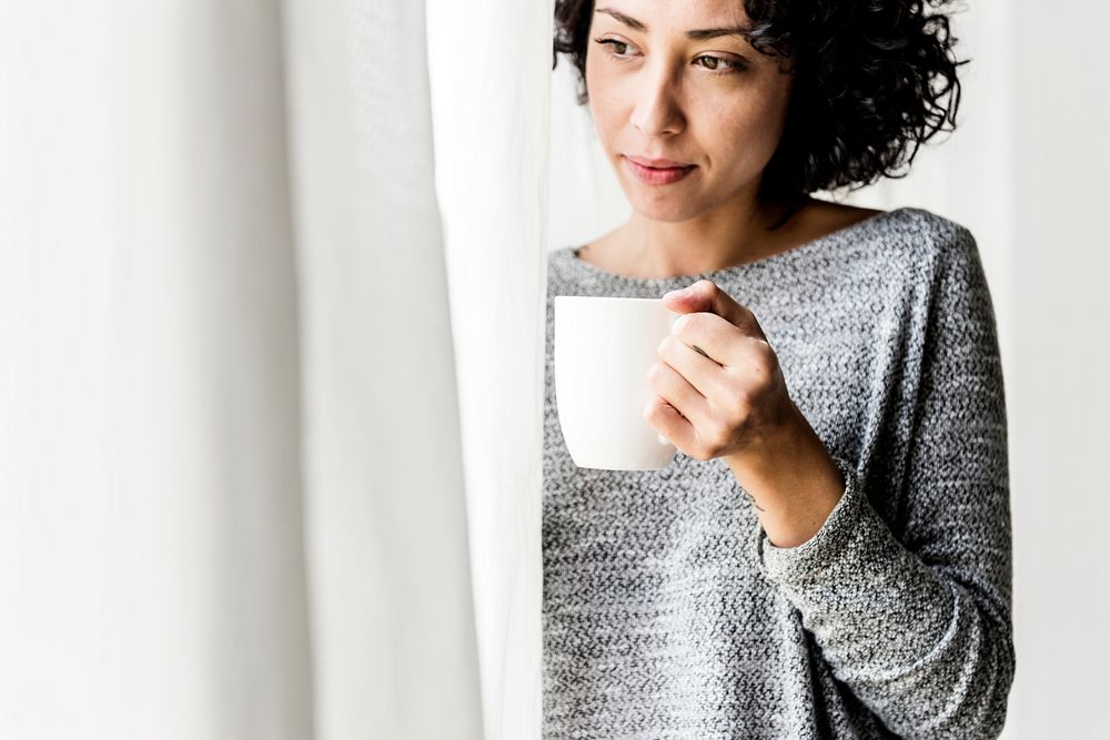 Woman is holding  coffee cup