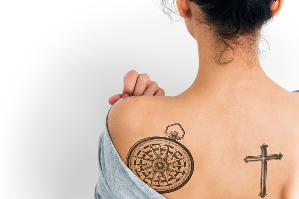 Back view portrait of a woman with a tattoo