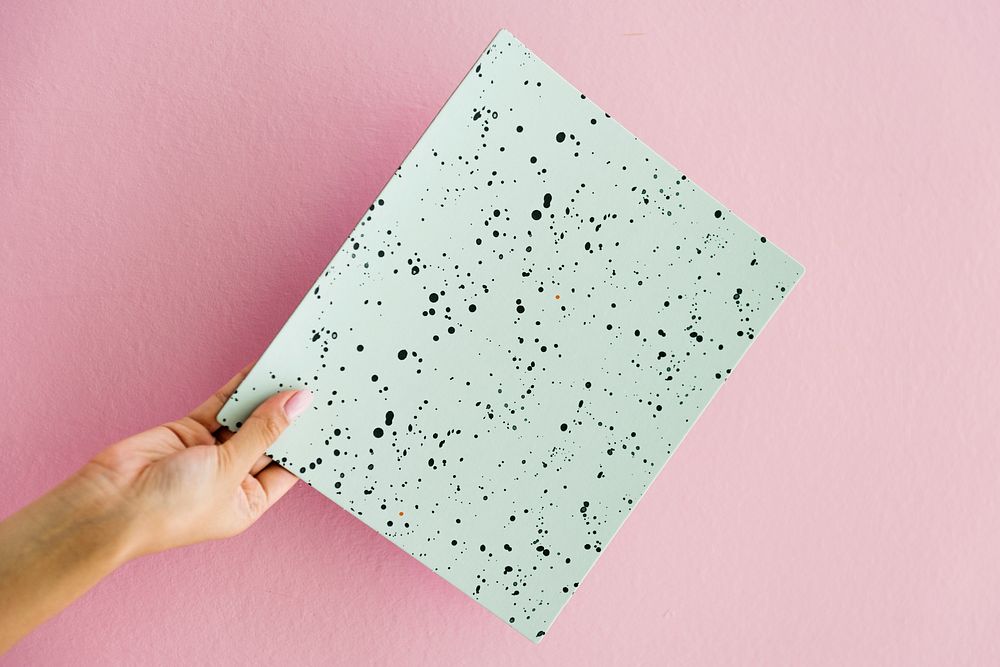 Hand holding dots paper
