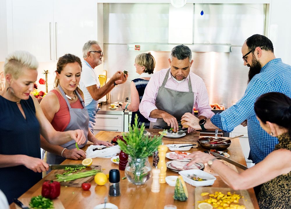 Group of friends are cooking in the kitchen