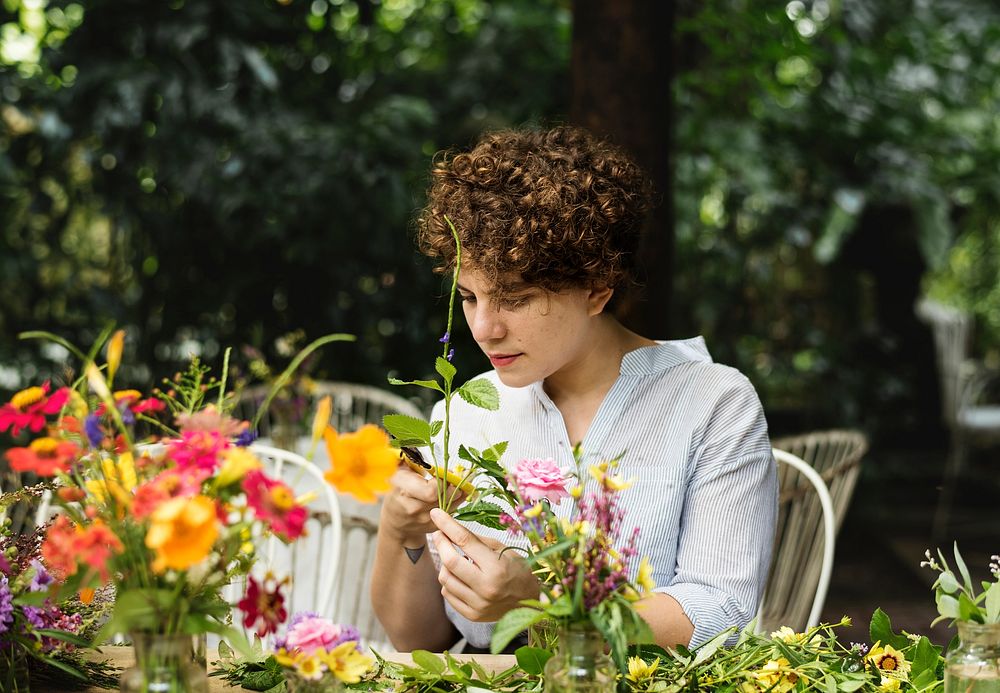 Woman arranging and decorating flowers