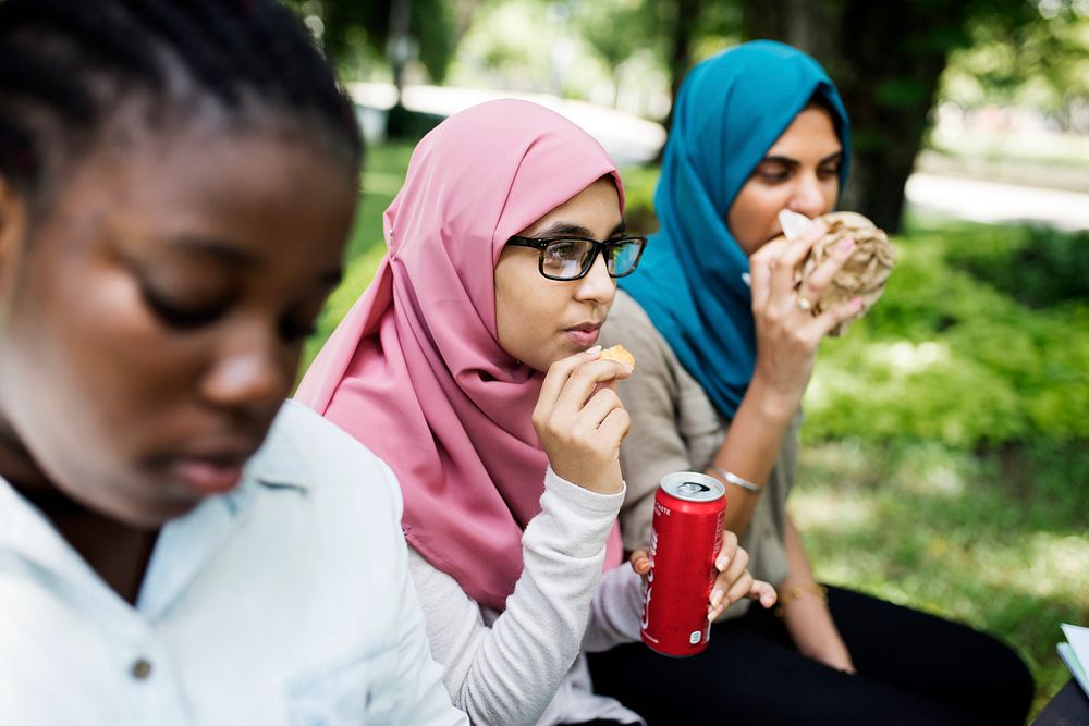 A group of diverse students are having lunch together