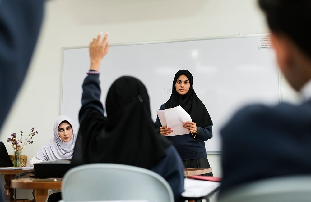 Diverse Muslim children studying in classroom
