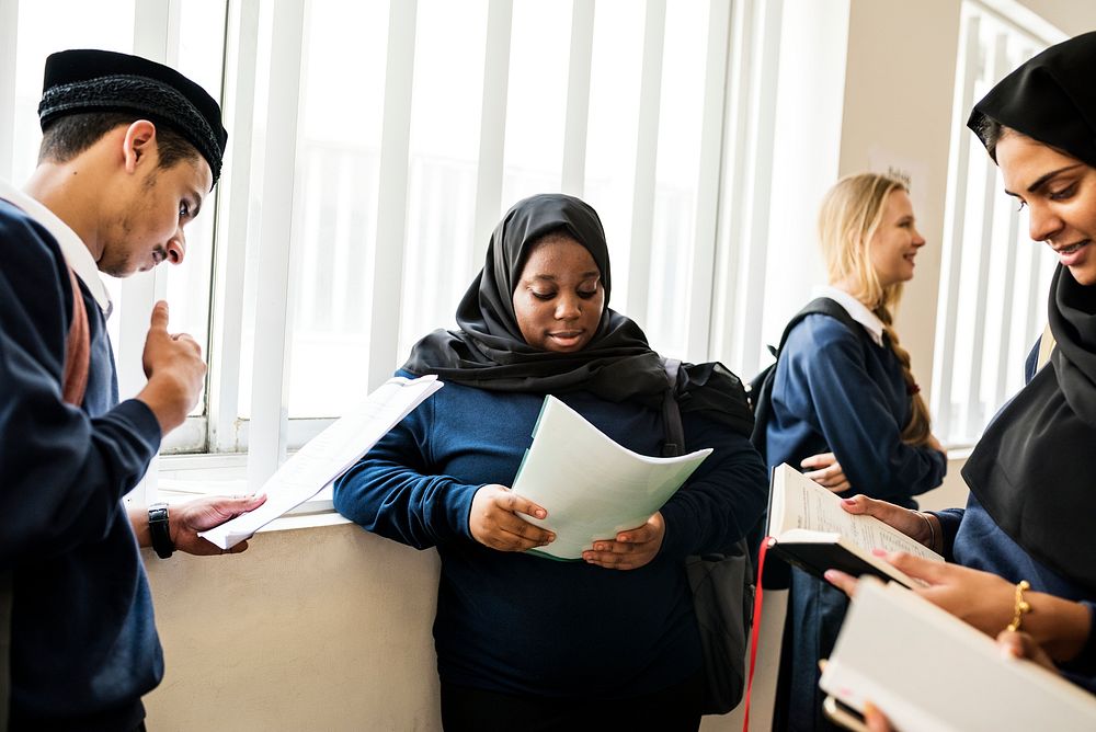 Diverse Muslim children studying in classroom