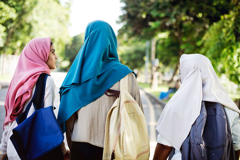 Group of Muslim school girls walking together outside
