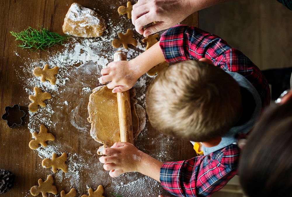 Boy making gingerbread cookies