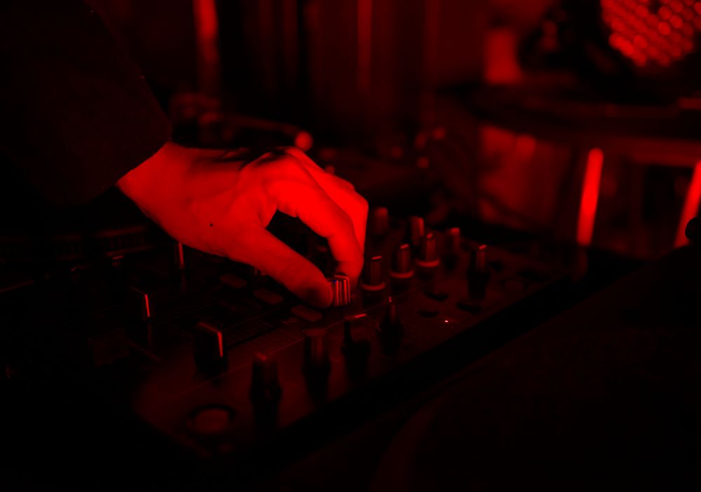 Closeup of hand on music volume