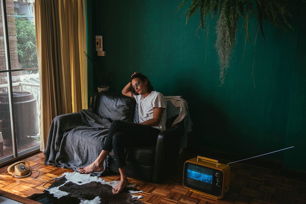 Hipster man sitting on a sofa | Premium Photo - rawpixel