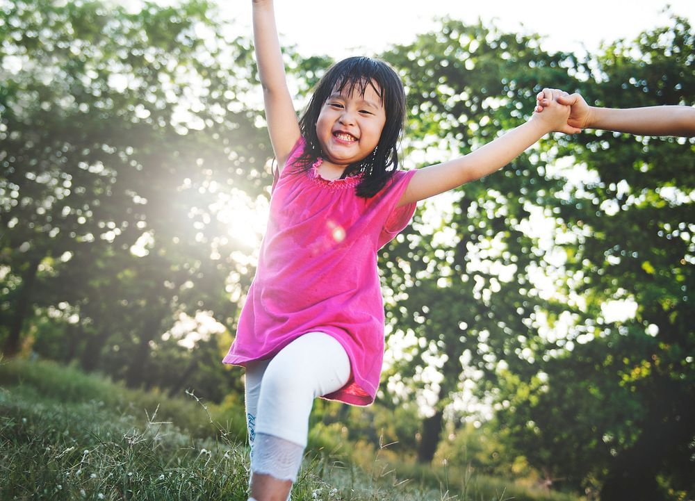 Little Asian girl playing in the park | Free Photo - rawpixel