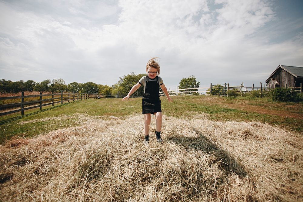 Little girl having fun in a farm