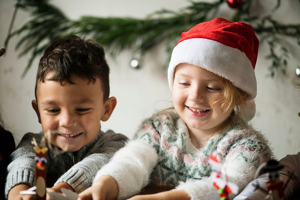 Two kids playing together on Christmas
