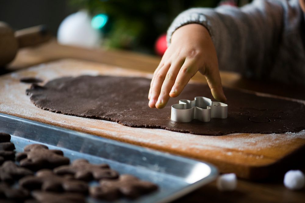Kid making a christmas cookies