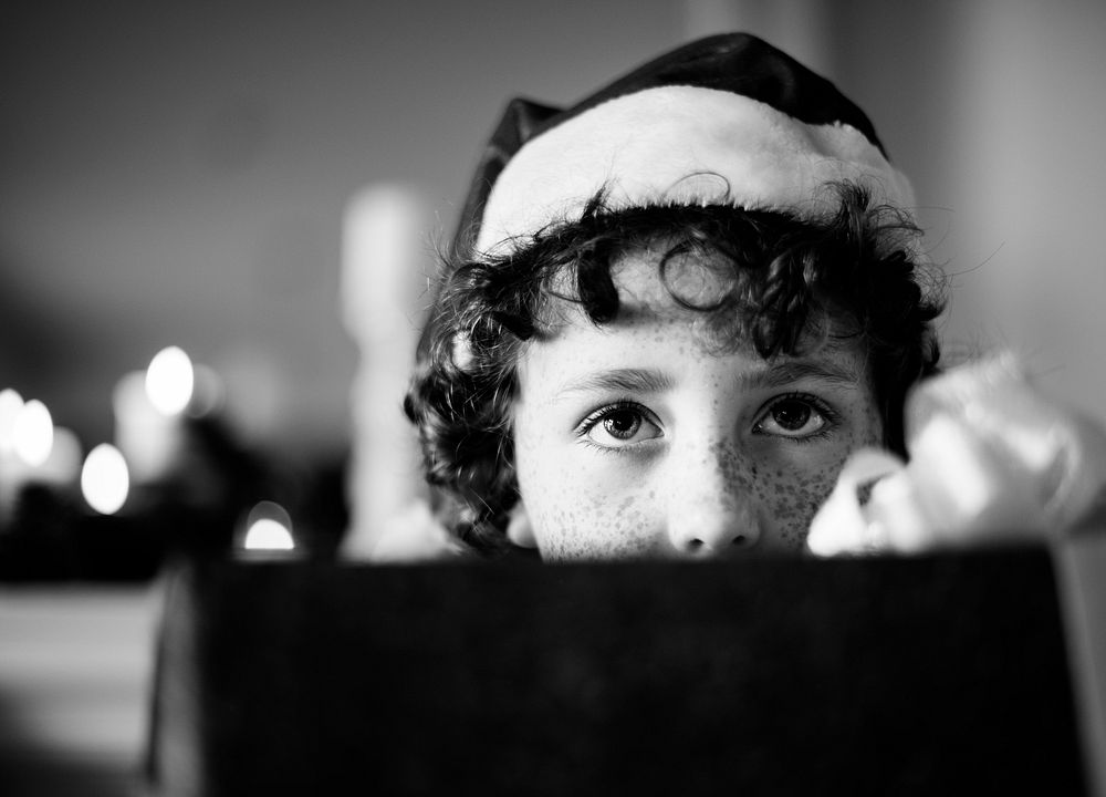 Young Caucasian boy with Christmas present box