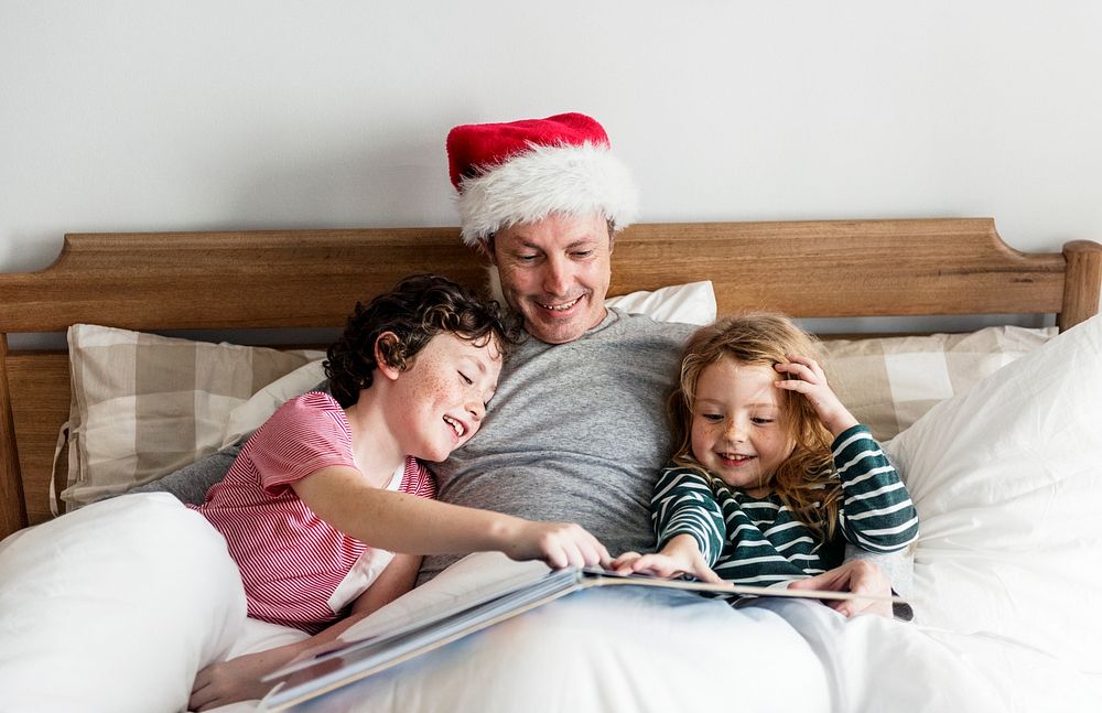 A father telling a Christmas story to his kids