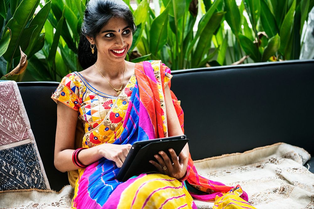 Indian woman using digital tablet