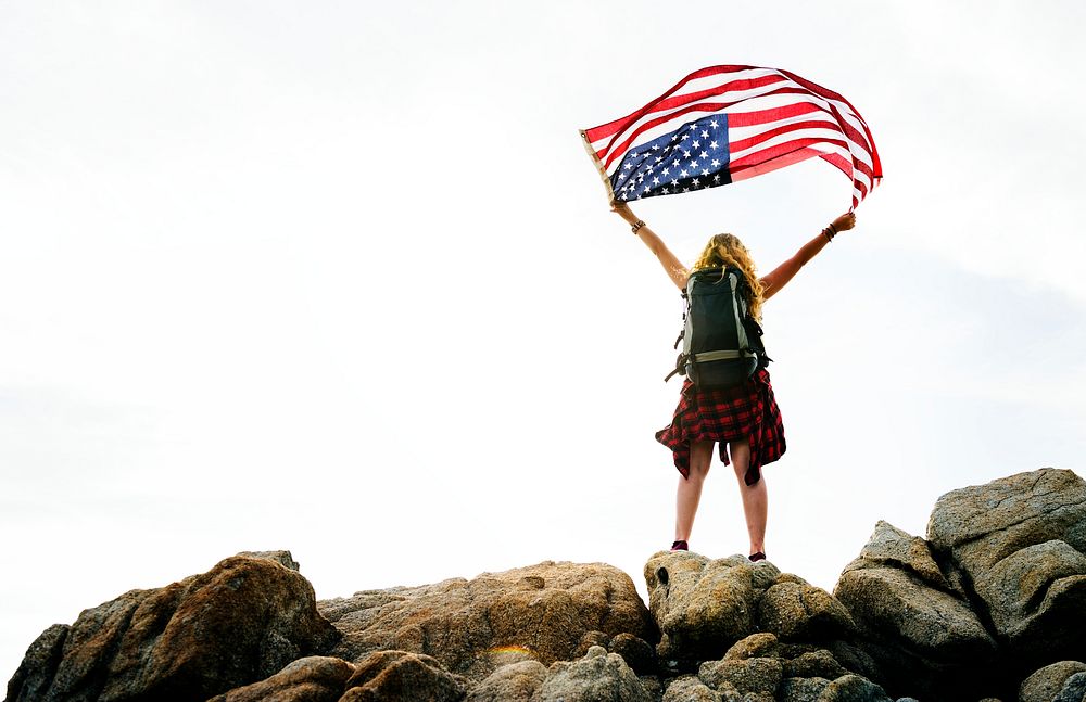 Caucasian woman holding American flag