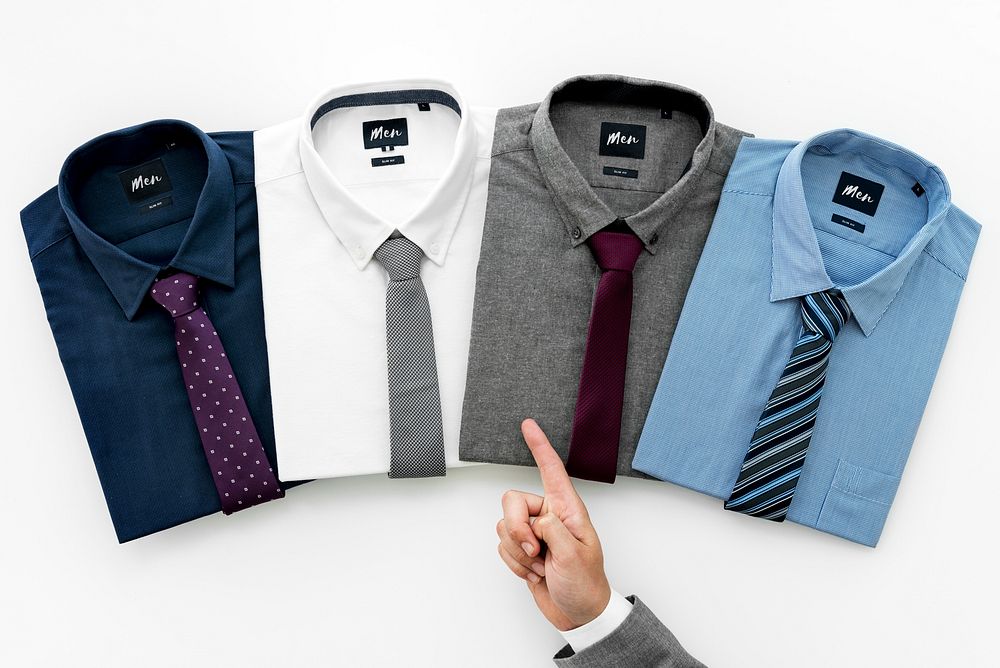 Businessman selecting shirt to wear