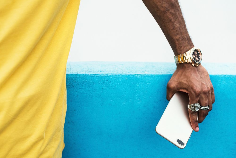African man holding a smart phone