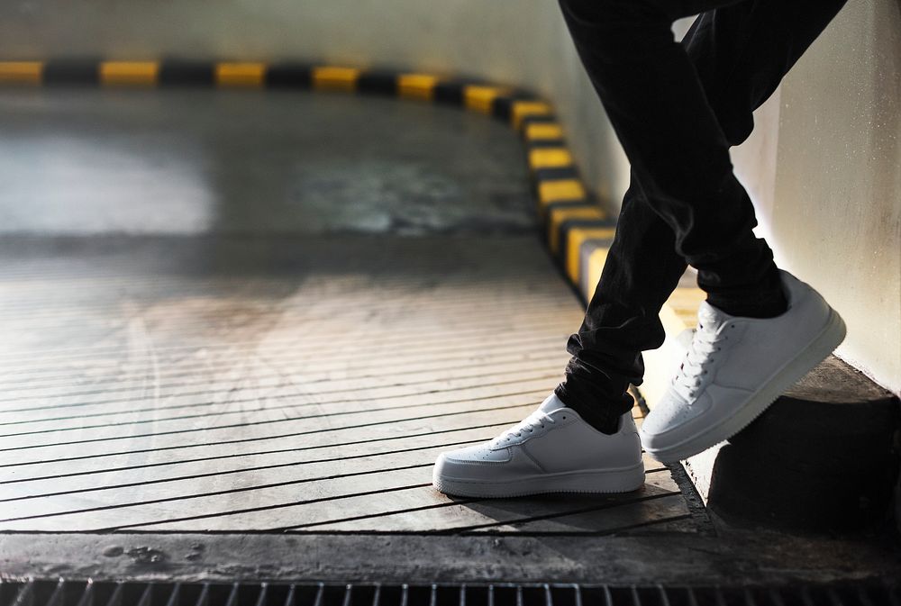 Shot of legs standing on an inclined pavement