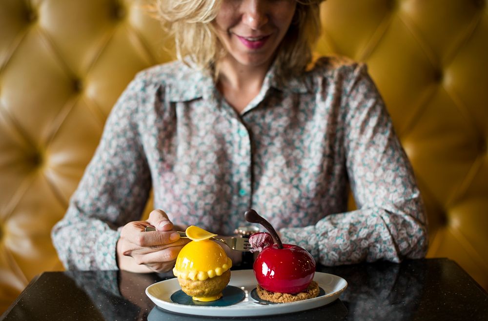 Woman with desserts at a cafe