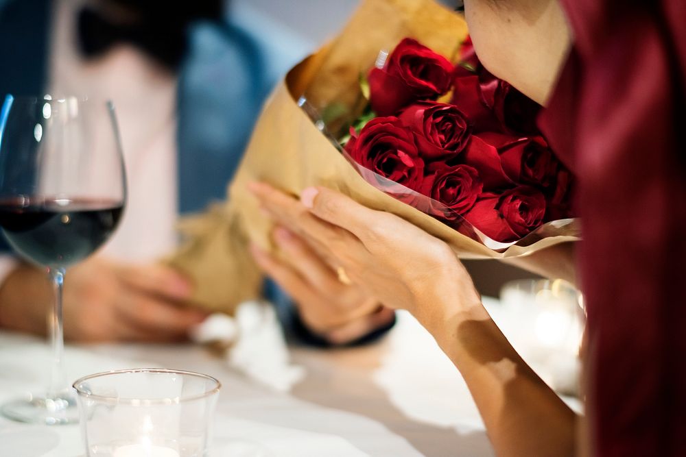 Man giving red rose bouquet