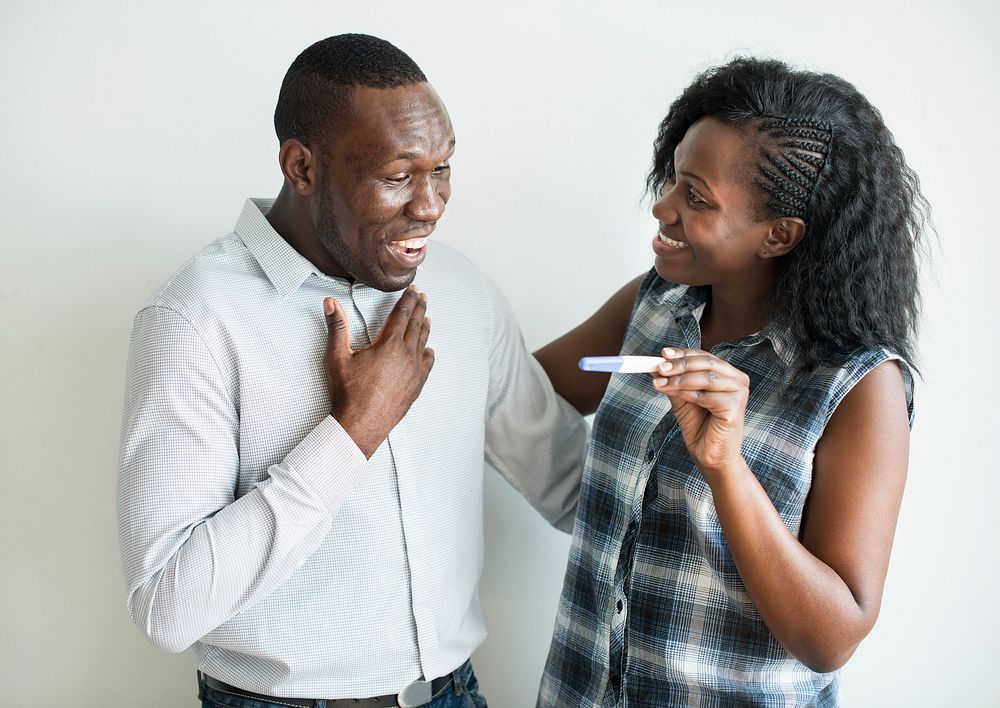 Black couple with a positive pregnancy test result