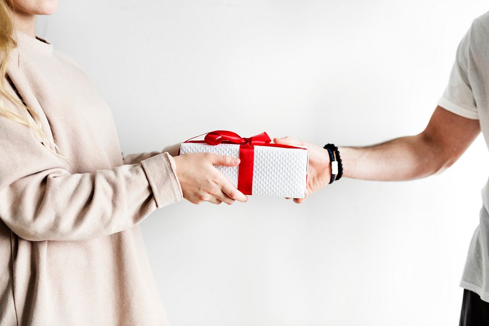 Couple receiving and giving a gift