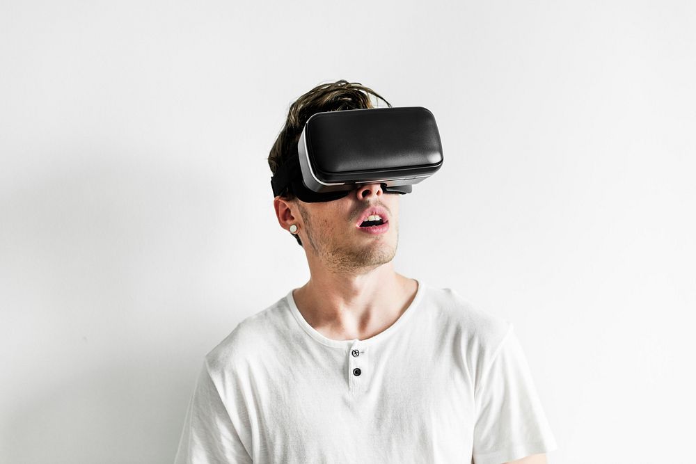 White man experiencing virtual reality with VR headset
