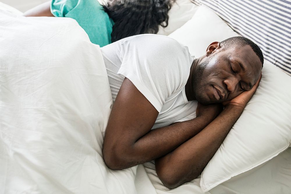 Black couple sleep together