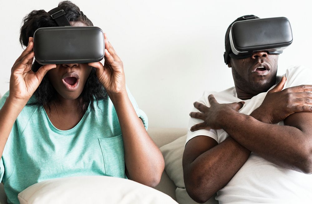Couple experiencing virtual reality with VR headset