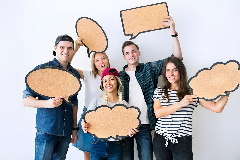 Happy young adults holding up copyspace placard thought bubbles