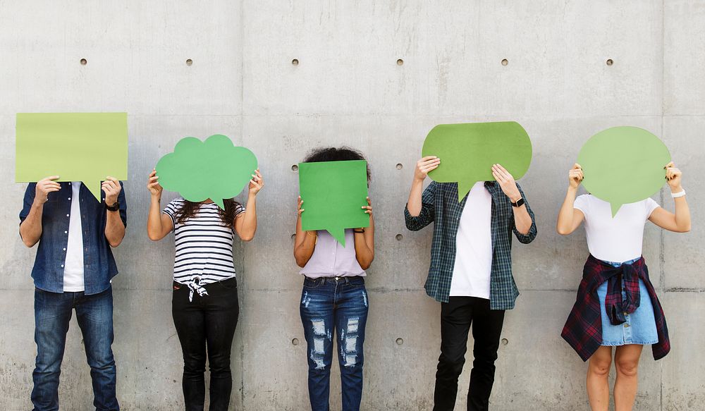 Group of young adults outdoors holding empty placard copyspace thought bubbles