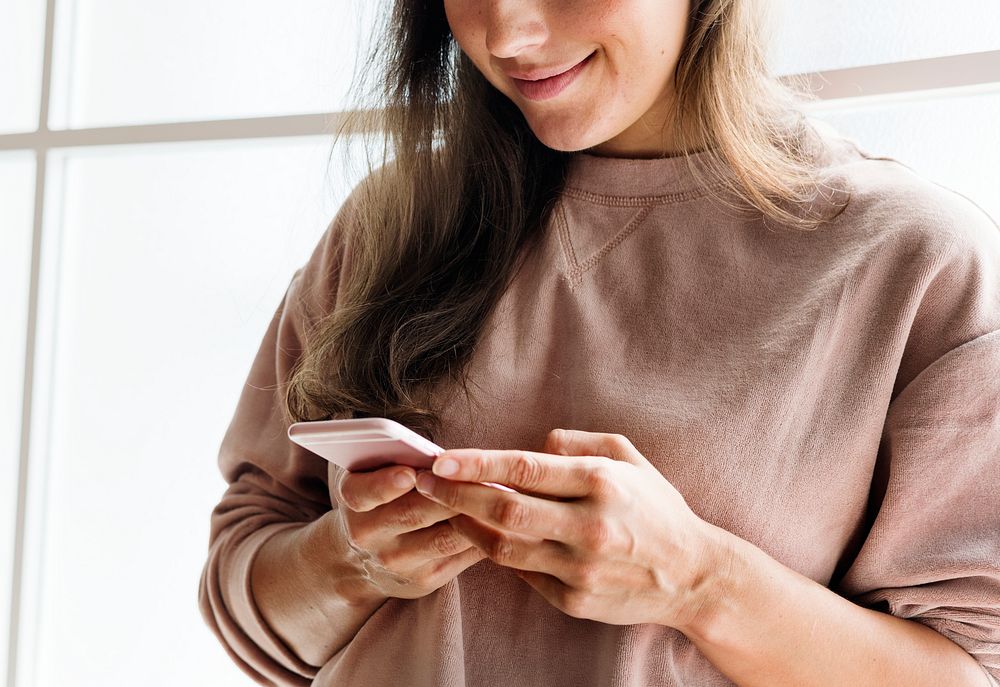 Woman using a smartphone social media concept