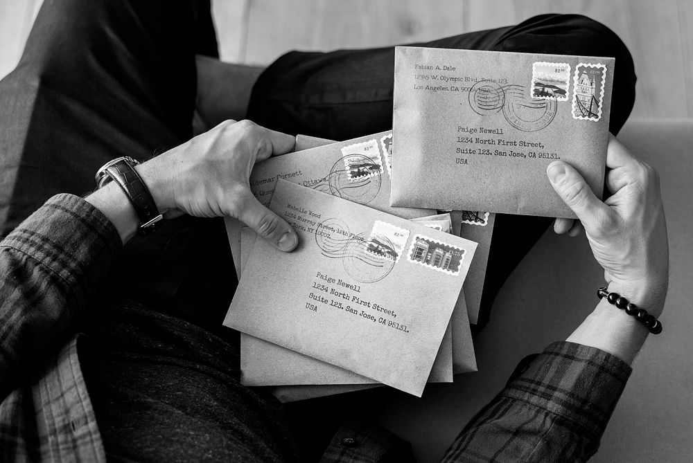 Aerial view of man selecting envelopes