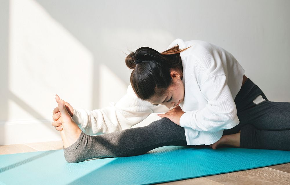 Asian woman stretching before exercise