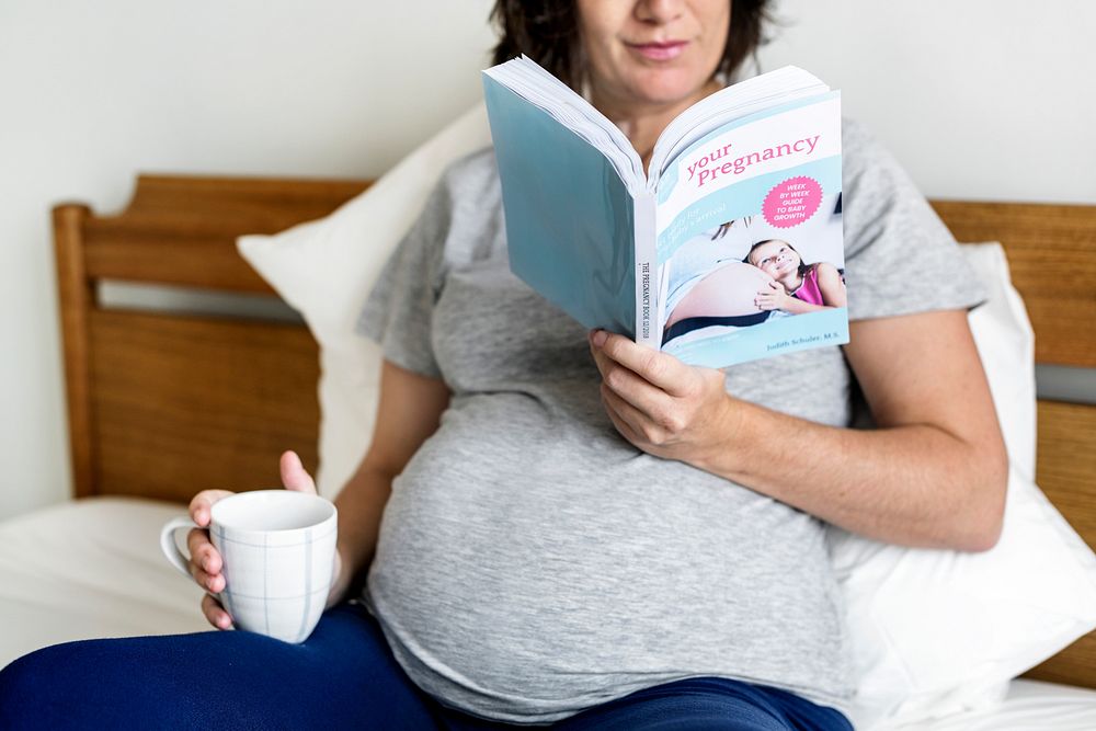 Pregnant woman reading book