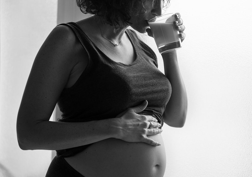 Woman drinking milk during her pregnancy